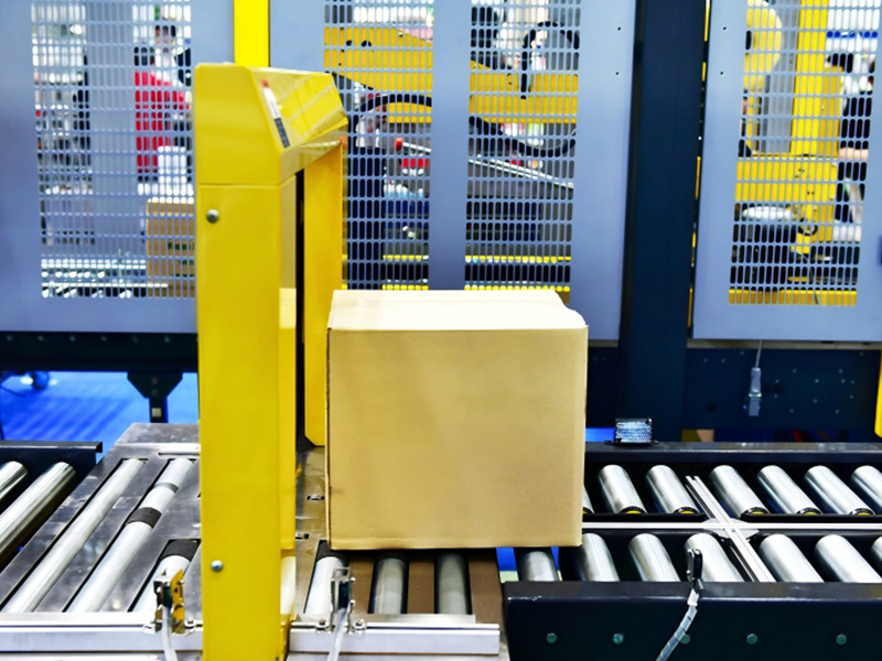 Cardboard boxes on conveyor belt at industry(